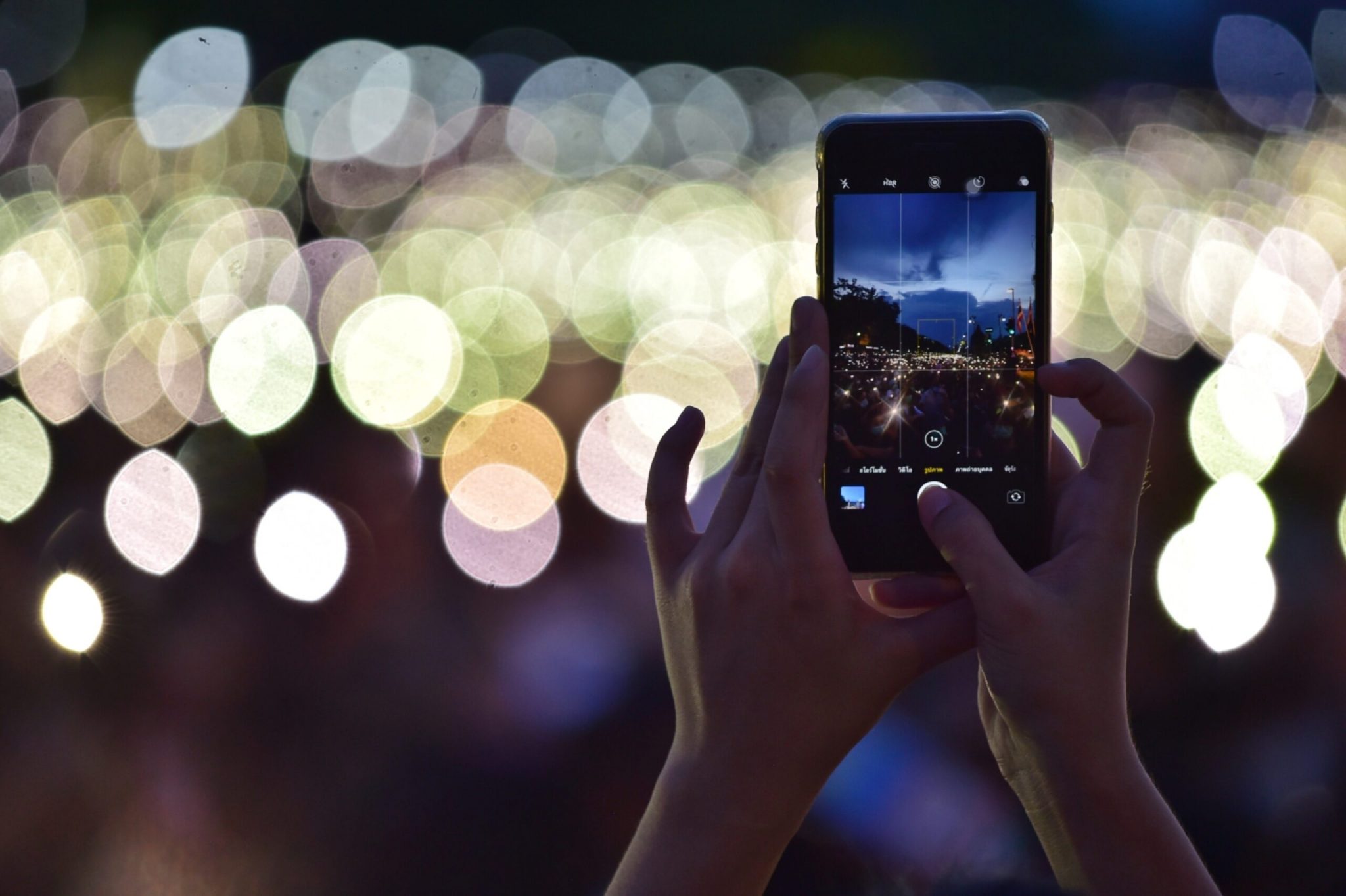 A protester using their phone at a rally Bangkok in August 2020.